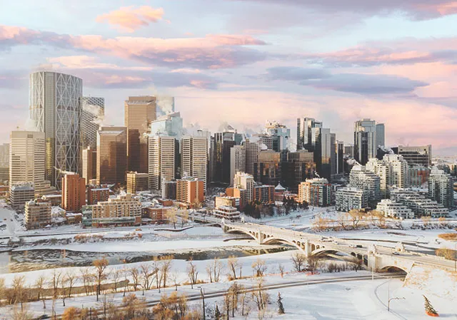 downtown Calgary skyline during a winter cotton-candy sunrise from s Rotary Park viewpoint