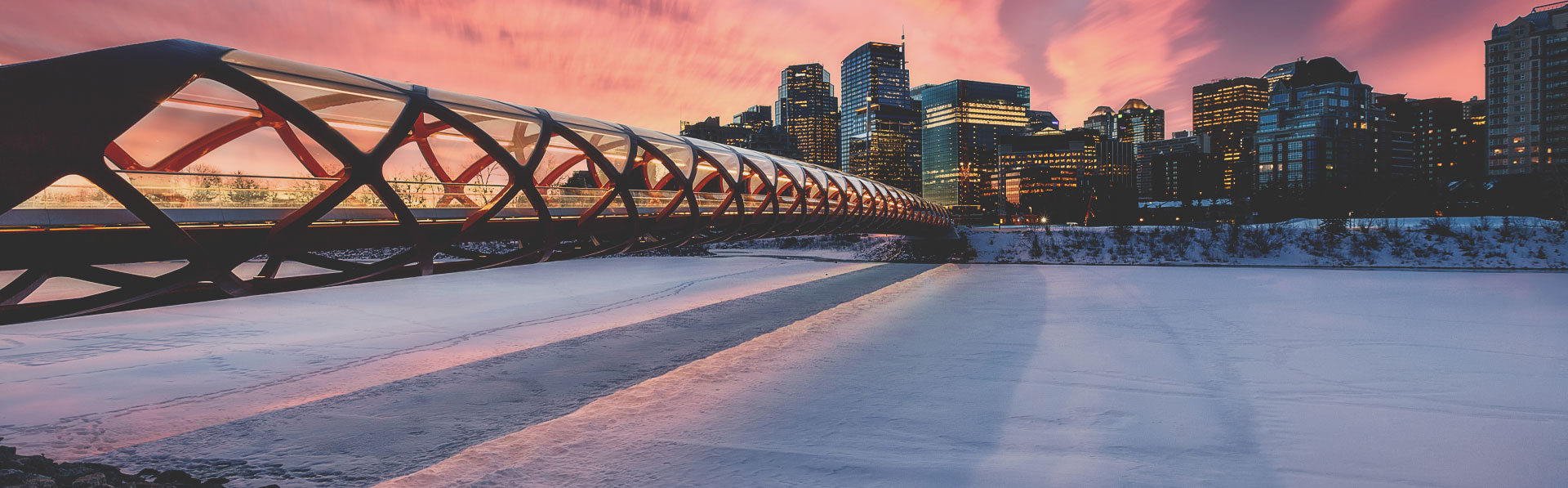 The Peace Bridge in Calgary over the frozen Bow River during Winter