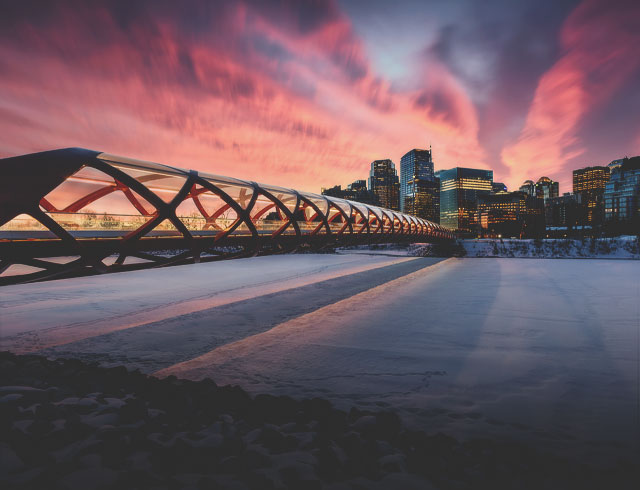 The Peace Bridge in Calgary over the frozen Bow River during Winter