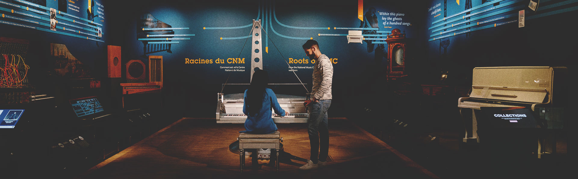Two people playing piano at Studio Bell