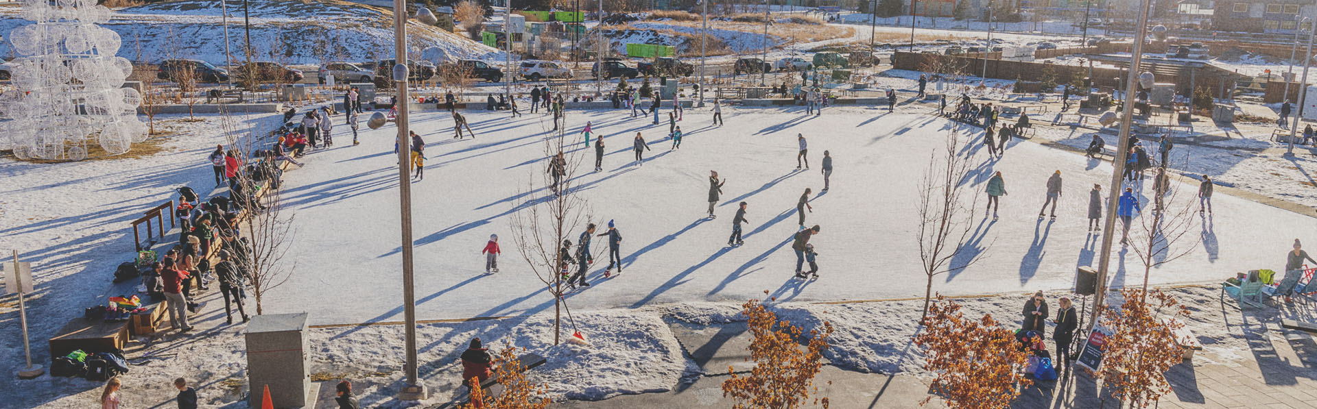 people outdoor ice skating at Central Commons Park in University District