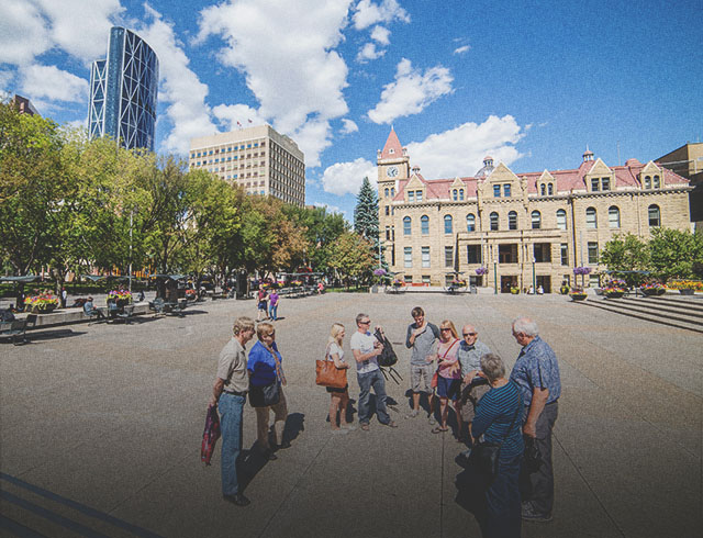 A group on a guided walking tour throughout downtown Calgary