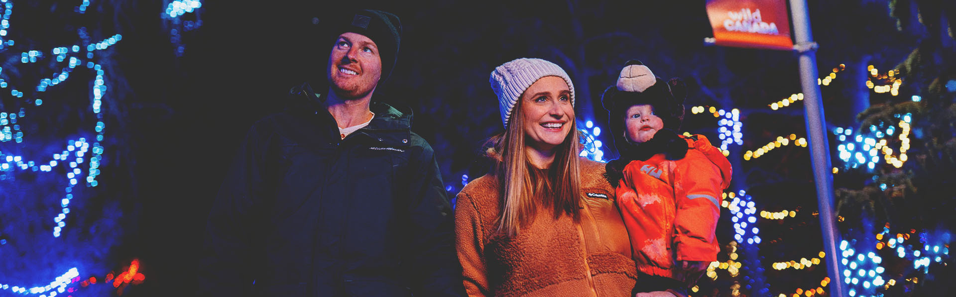 A family is enjoying Zoolights at the Wilder Institute/Calgary Zoo