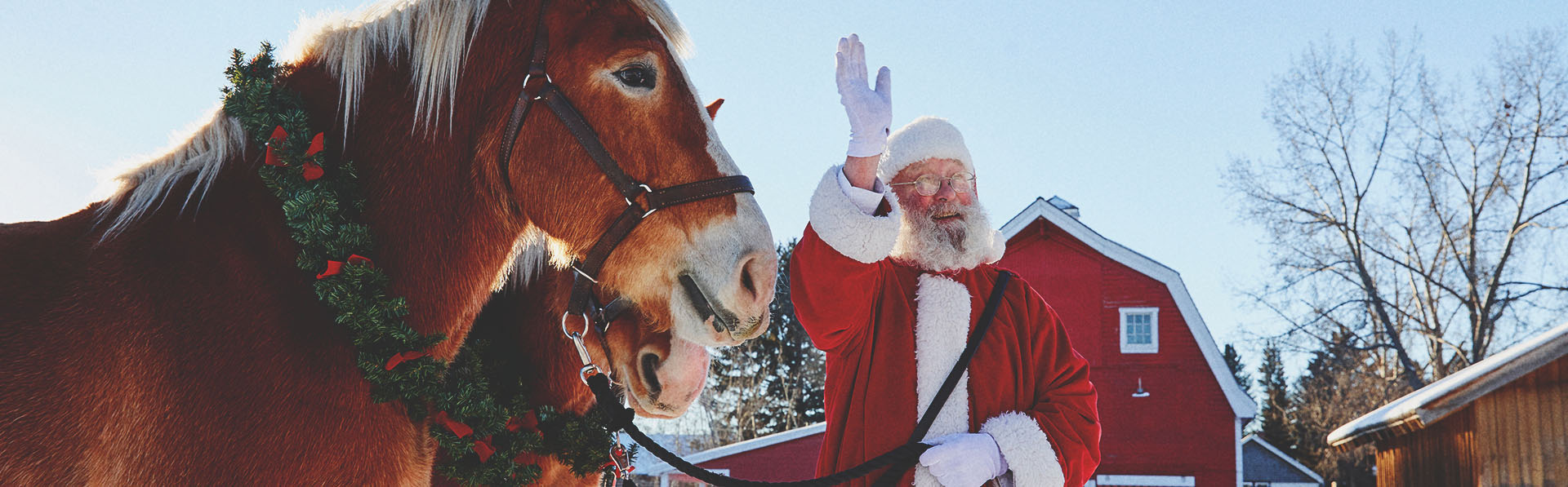 Santa is with horses at Heritage Park in Calgary