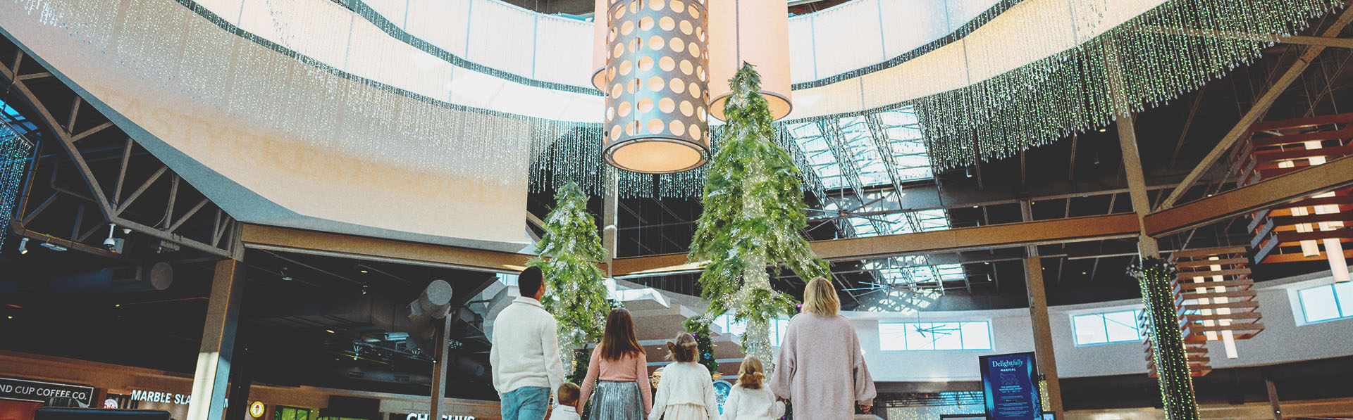 A family at CrossIron Mills shopping mall in calgary