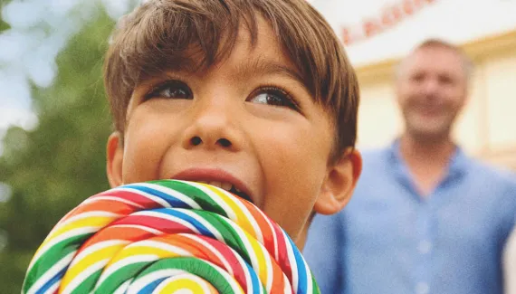 Young boy with a lollipop at one of Calgary's Top Attractions