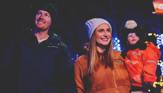 A family is enjoying Zoolights at the Wilder Institute/Calgary Zoo