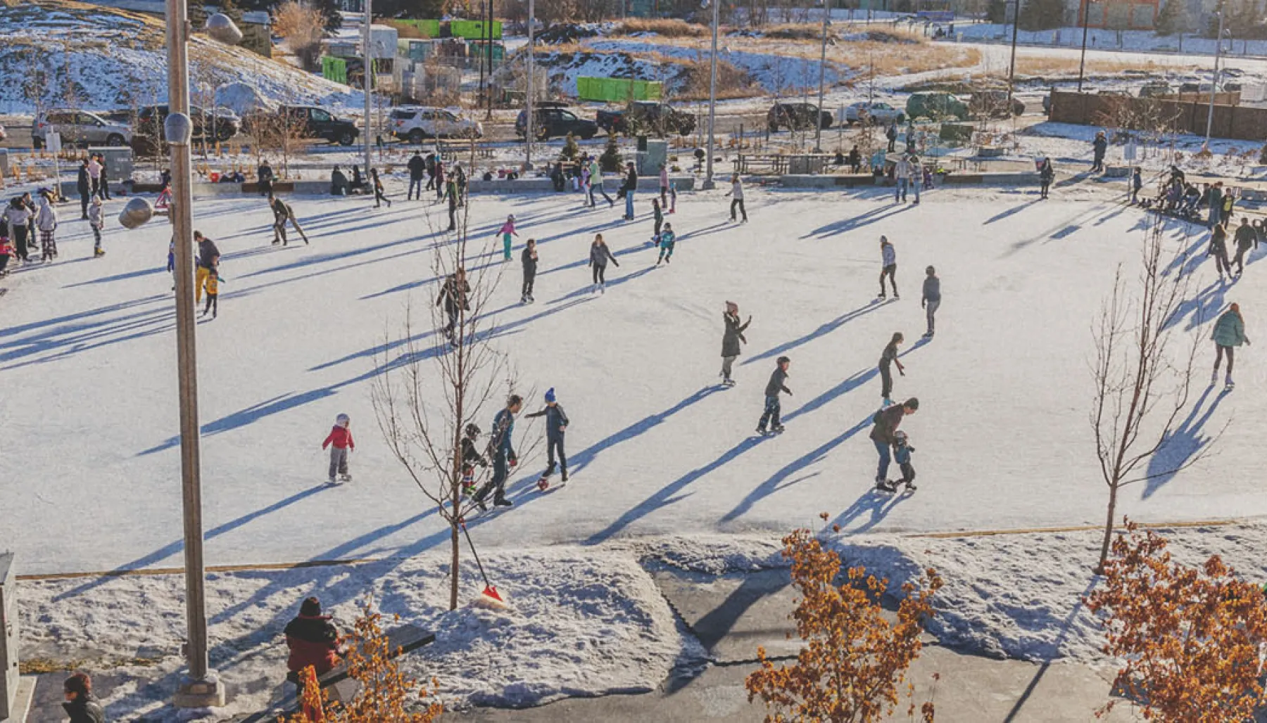 people outdoor ice skating at Central Commons Park in University District