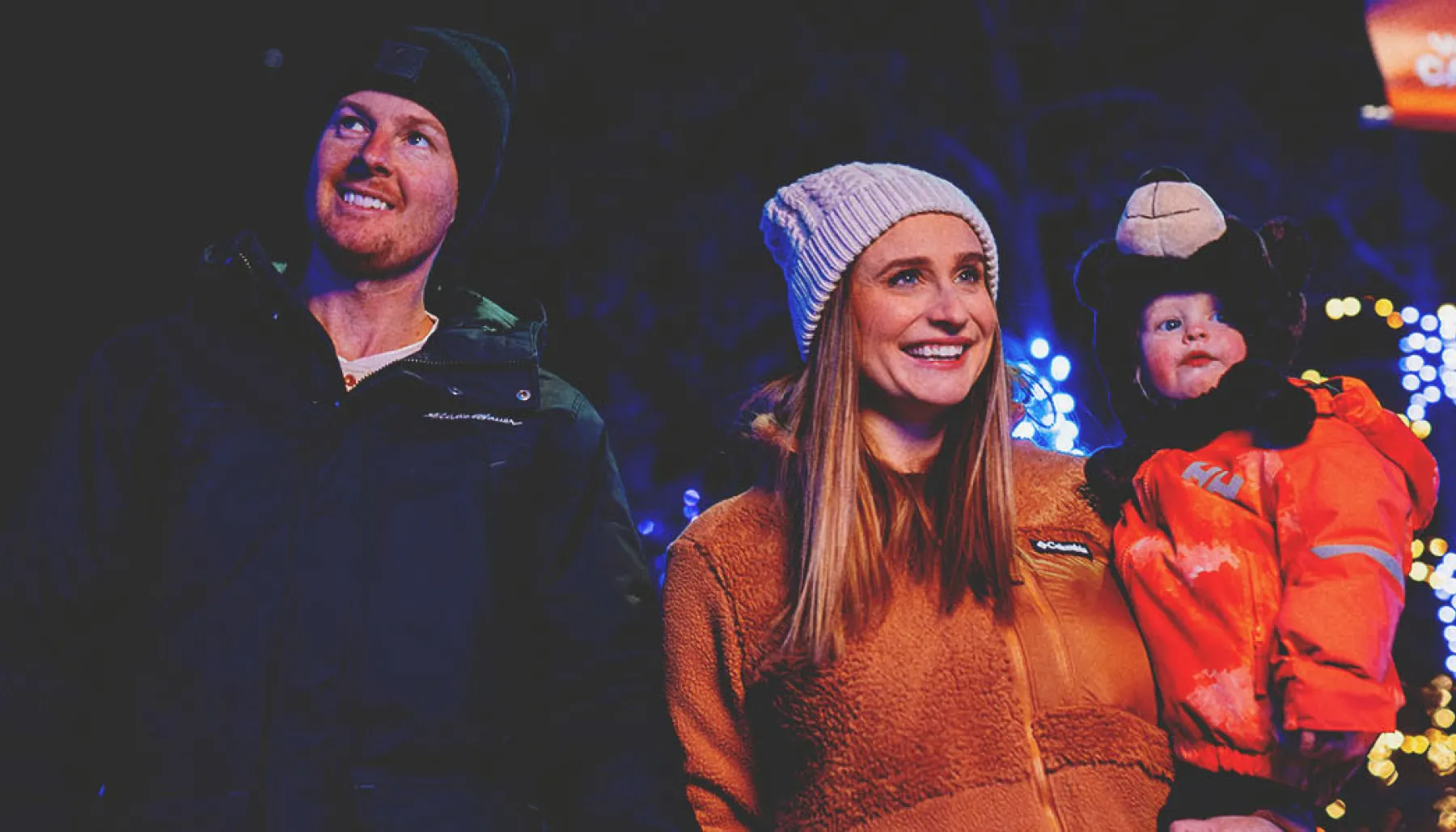 A family is enjoying Zoolights at the Wilder Institute/Calgary Zoo