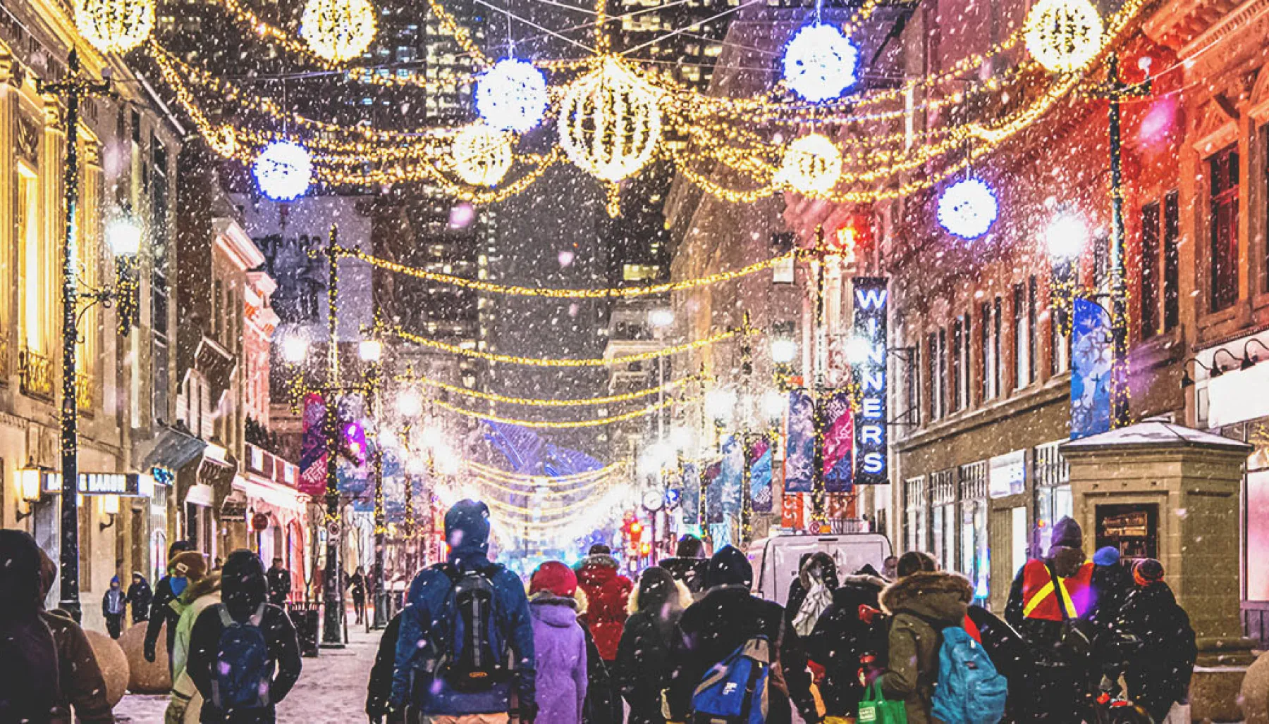 people walking along Stephen Avenue during winter