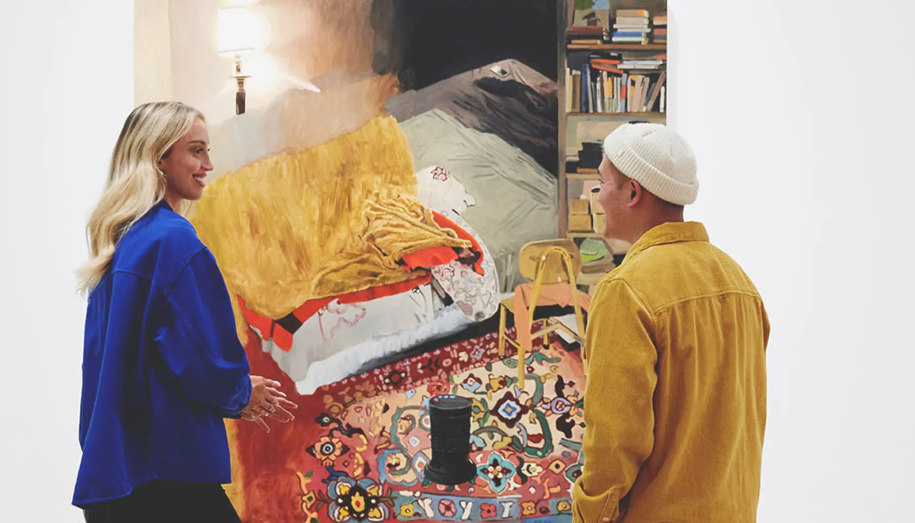 two people talking in front of an artwork at the Esker Foundation