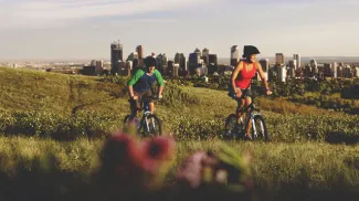 Biking on Nose Hill with the Calgary skyline in the background