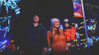 A family is enjoying Zoolights at the Wilder Institute/Calgary Zoo