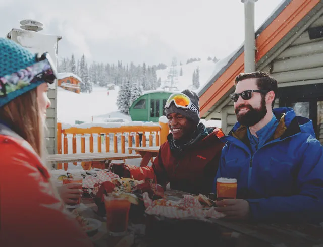 Friends having lunch at a ski resort