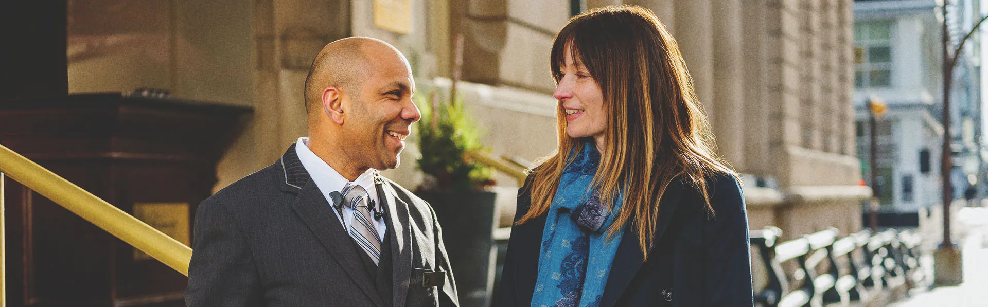 Concierge helping a guest outside the Fairmont Palliser