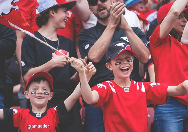 Young fans cheering on the Stampeders