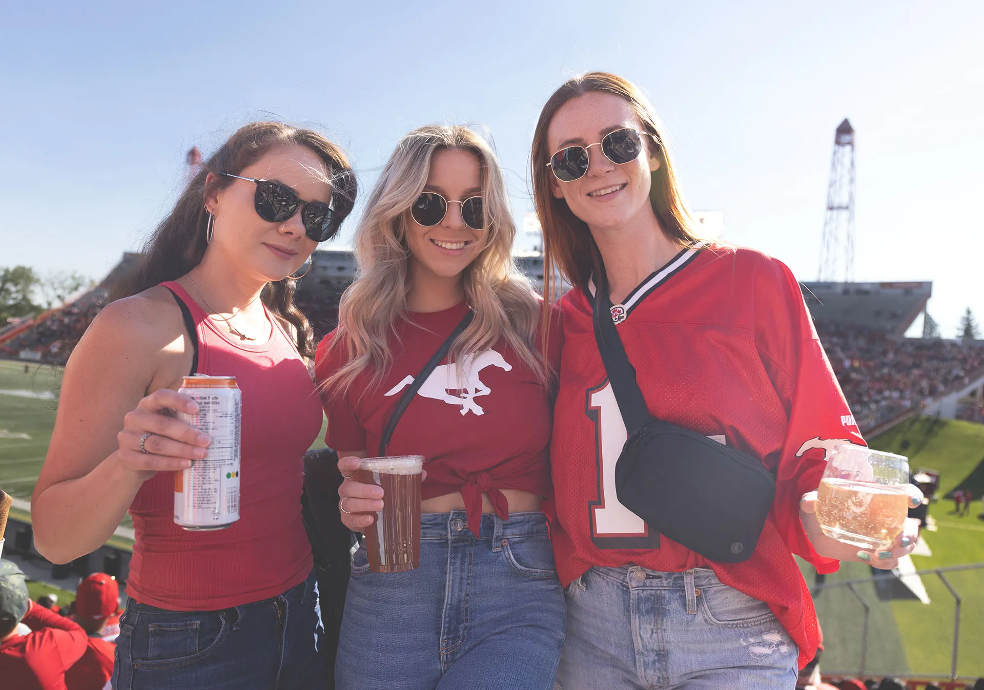 fans enjoying drinks at McMahon Stadium