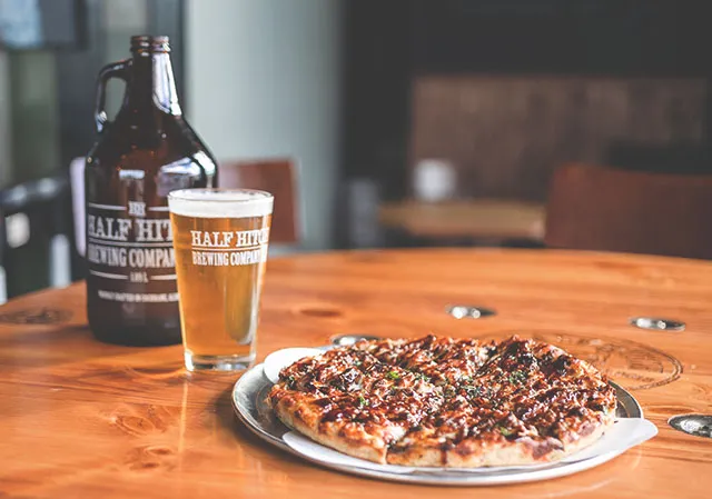 pint of beer with a pizza from The Mash