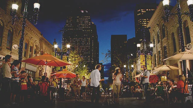 people dancing to live music along Stephen Avenue in downtown Calgary