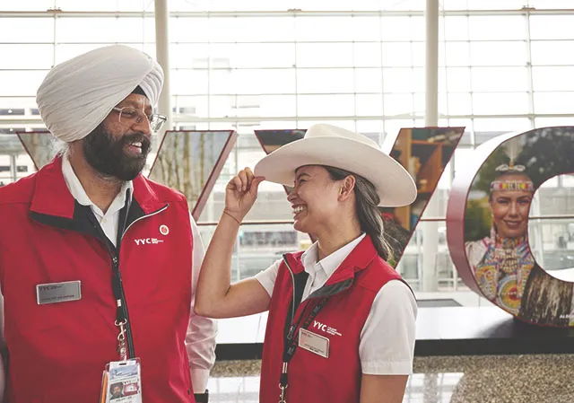 White Hat greeters wait to welcome visitors to Calgary