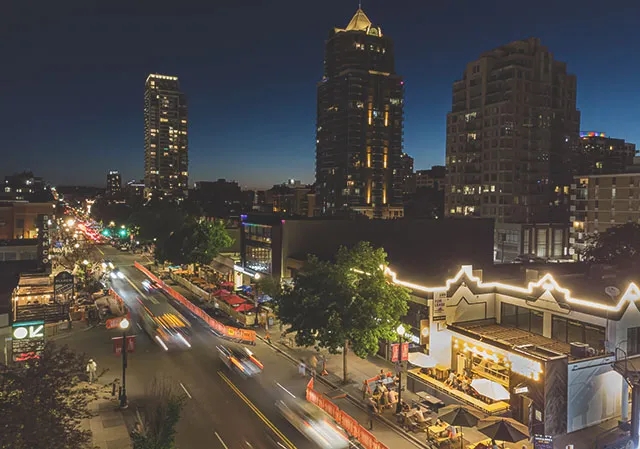 aerial view of Calgary's bustling 17th Avenue at night