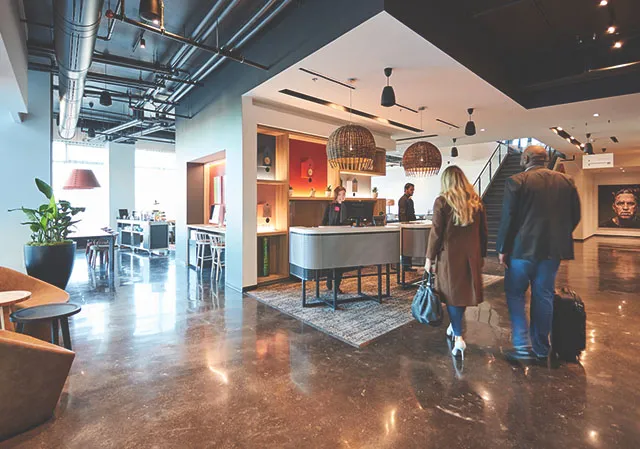 couple checking in to the Alt Hotel in East Village