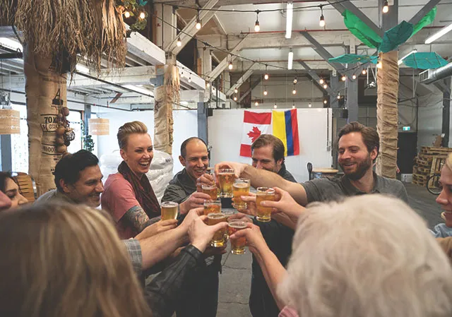 group cheersing beer samples on a craft beer tour