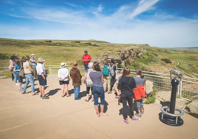 group on a tour of head-smashed-in buffalo jump