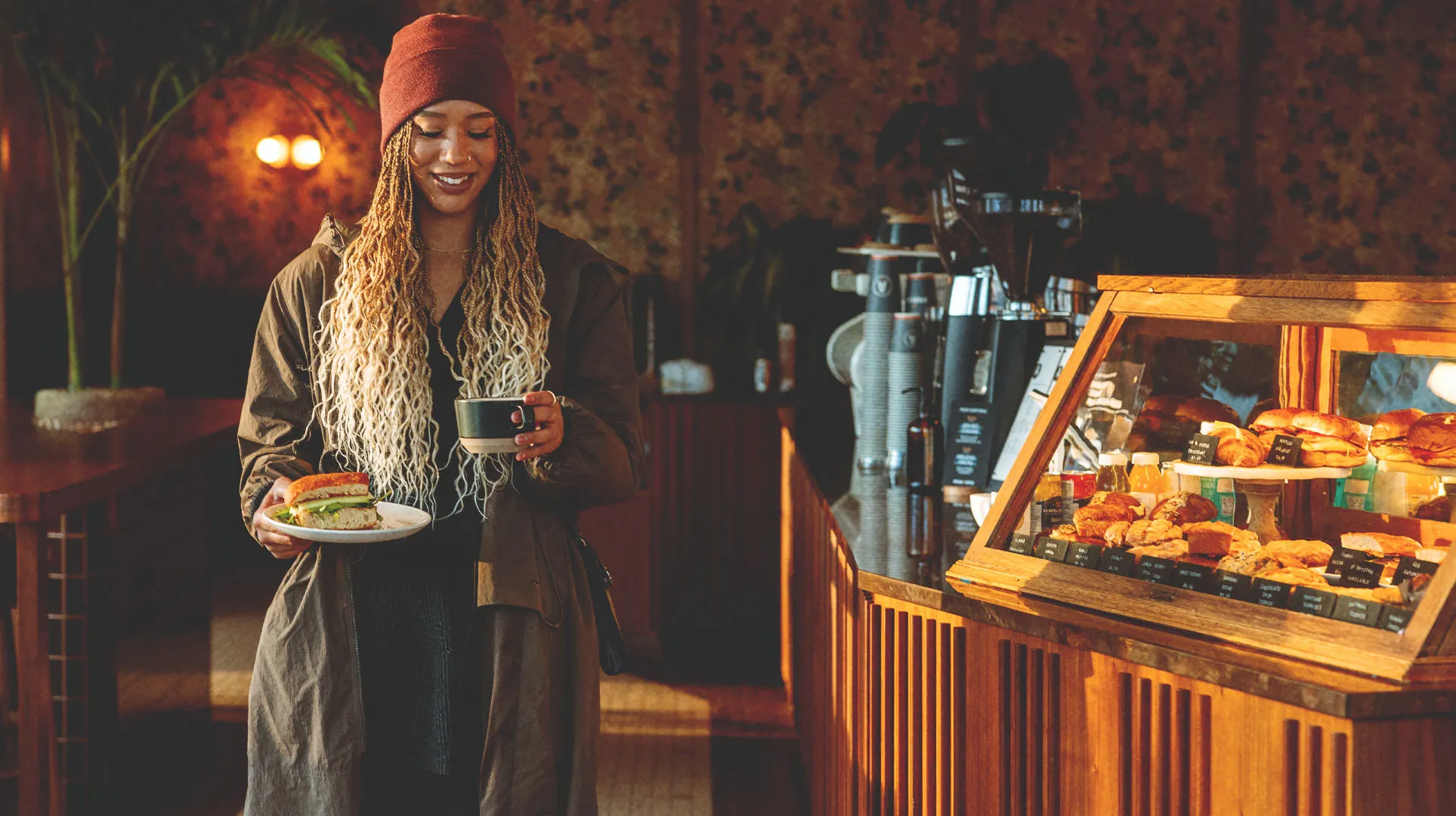 Women picks up her coffee at Analog Coffee Shop