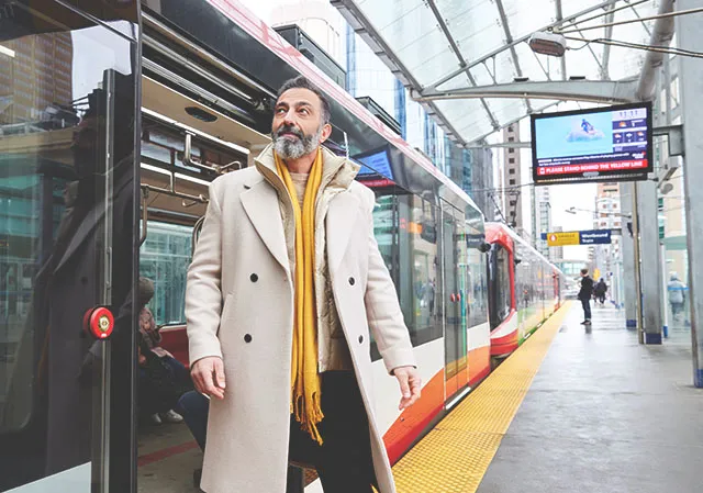 A man is at the CTrain station downtown Calgary