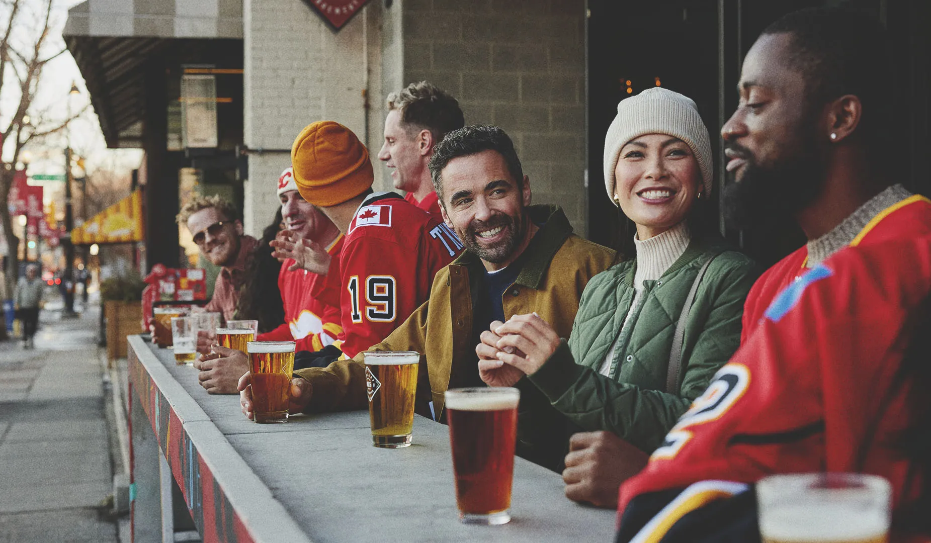 a group of friends are chatting and enjoying beers in calgary 